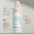 Moroccanoil Moisture Repair Conditioner bottle with ingredients listed on a light gray background