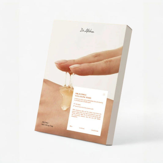 Dr. Althea Vita Glow Mask box with a hand showing the essence, emphasizing hydration and skin radiance.