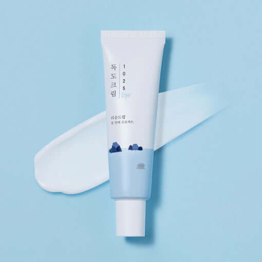 Round Lab Dokdo Eye Cream 30ml tube with a smooth cream texture, promoting whitening and wrinkle care for beautiful eyes.